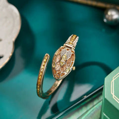 ✨ שעון קווורץ לנשים עם עיצוב נחש וצמיד ריינסטון – מתנה אופנתית לאישה 💎