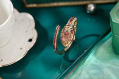 ✨ שעון קווורץ לנשים עם עיצוב נחש וצמיד ריינסטון – מתנה אופנתית לאישה 💎